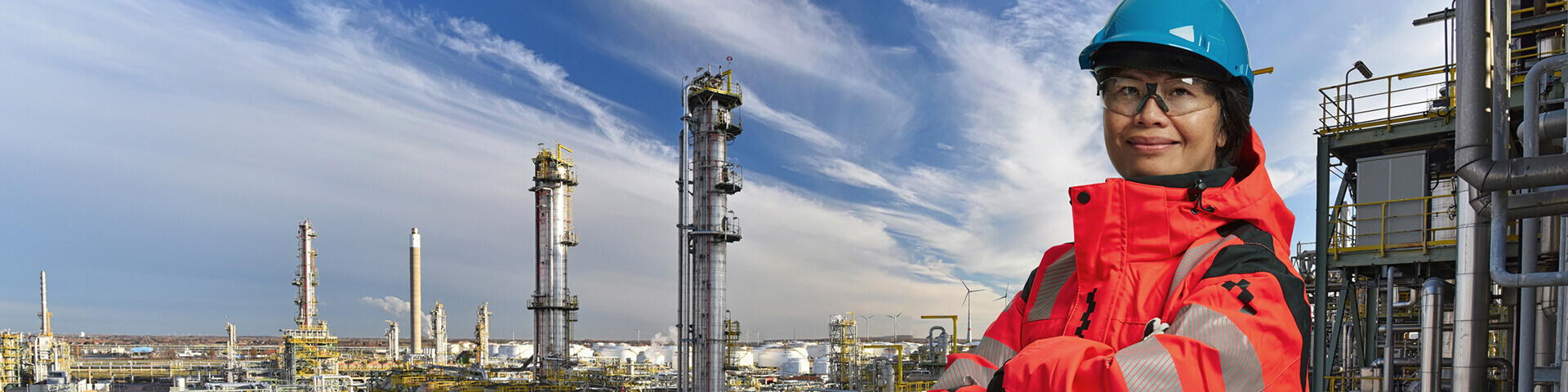 female-asian-engineer-infront-of-refinery-banner.jpg